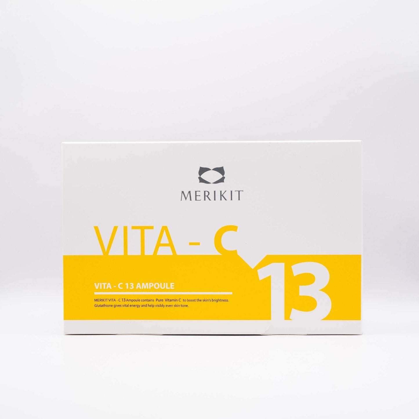 MERIKIT Vita-C 13 Ampoules box with bright yellow and white design, containing high-potency vitamin C serum for skin brightening and anti-aging.