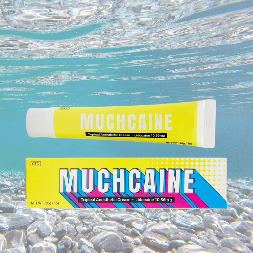 Muchcaine numbing cream tube and box underwater.
