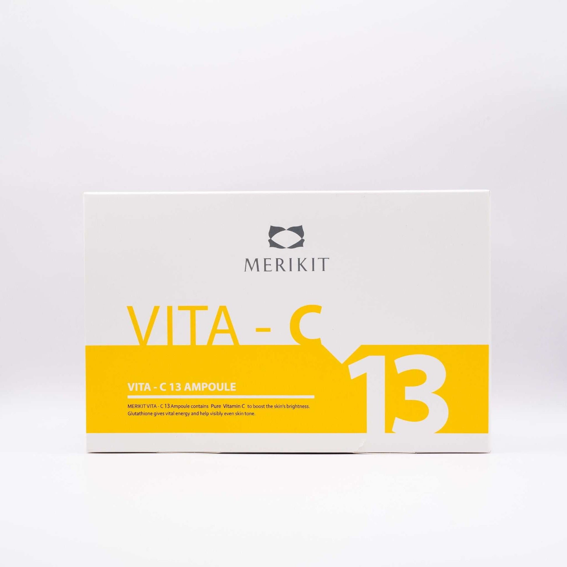 MERIKIT Vita-C 13 Ampoules box with bright yellow and white design, containing high-potency vitamin C serum for skin brightening and anti-aging.