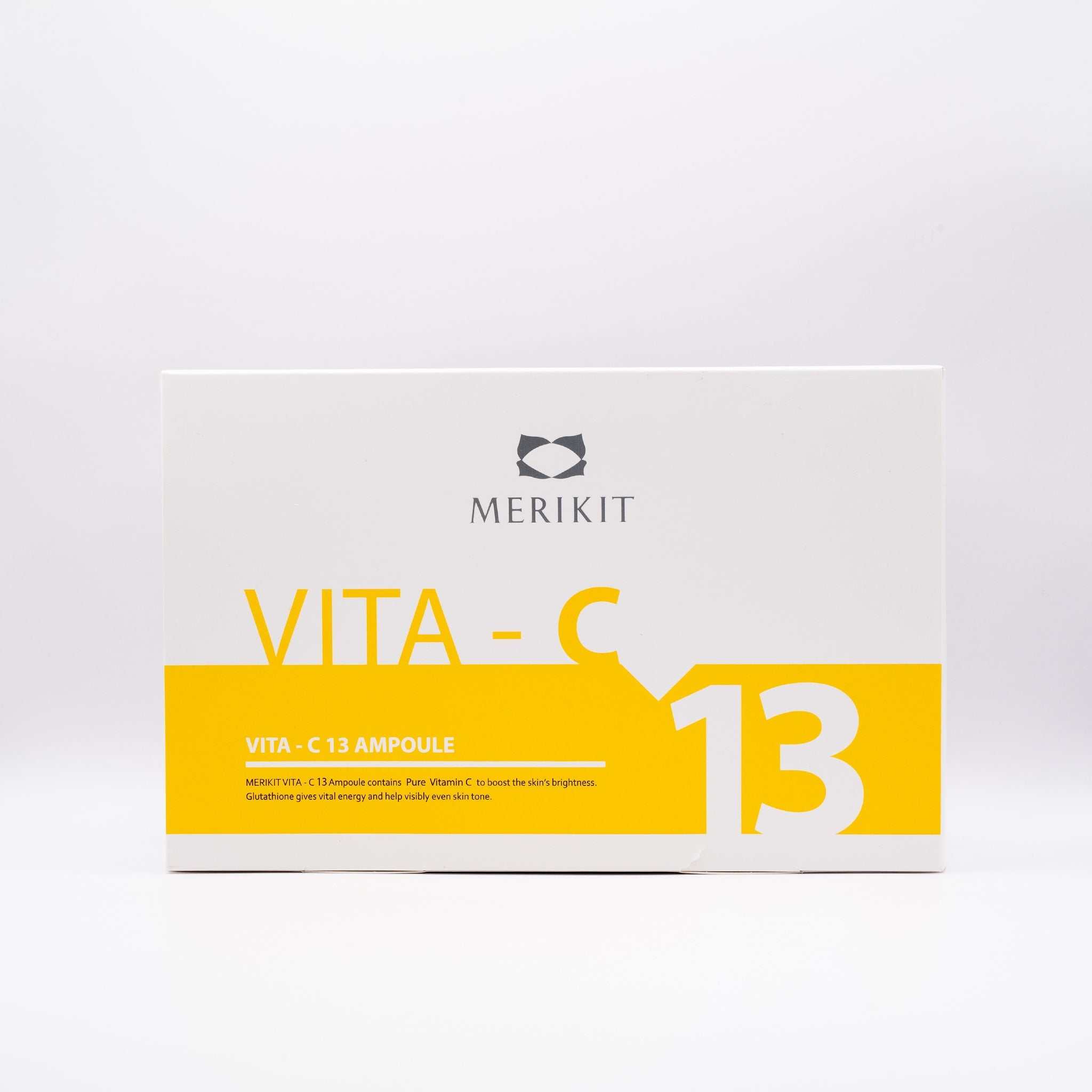MERIKIT Vita-C 13 Ampoules box with bright yellow and white design, containing high-potency vitamin C serum for skin brightening and anti-aging.