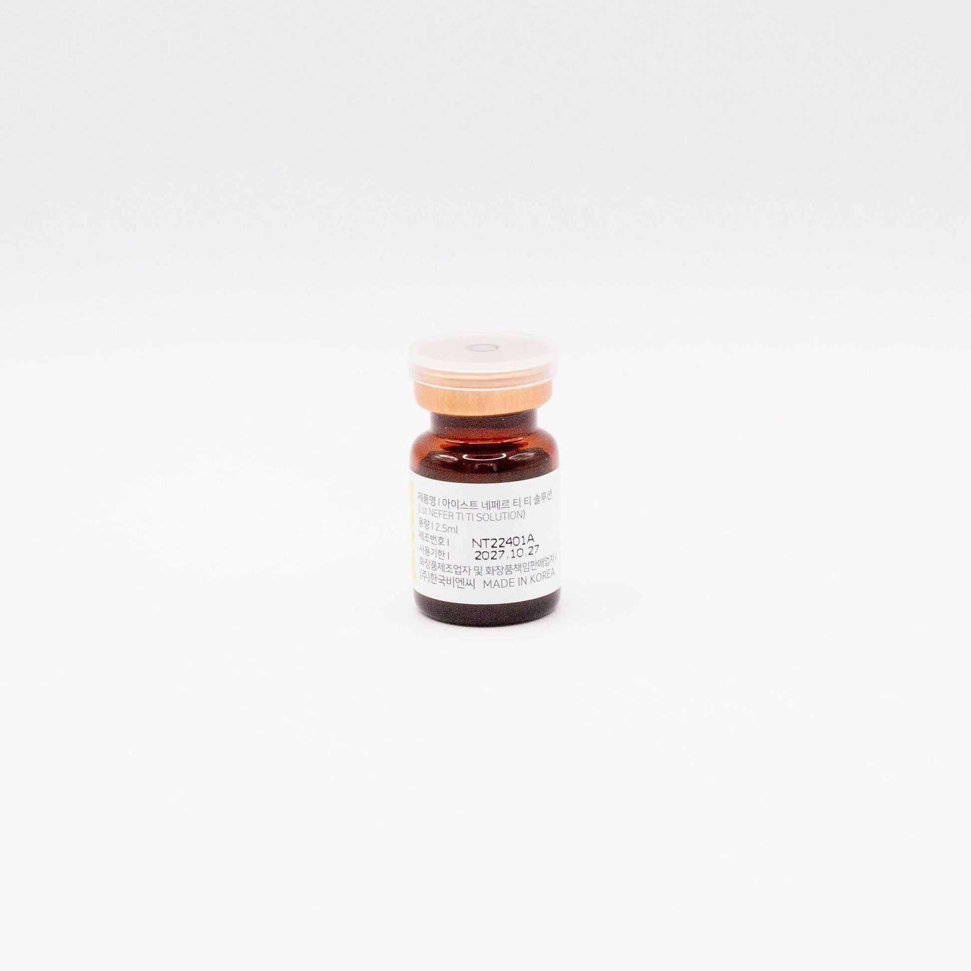 Small amber vial of 1.st NEFER TI TI skinbooster solution for anti-aging and skin hydration