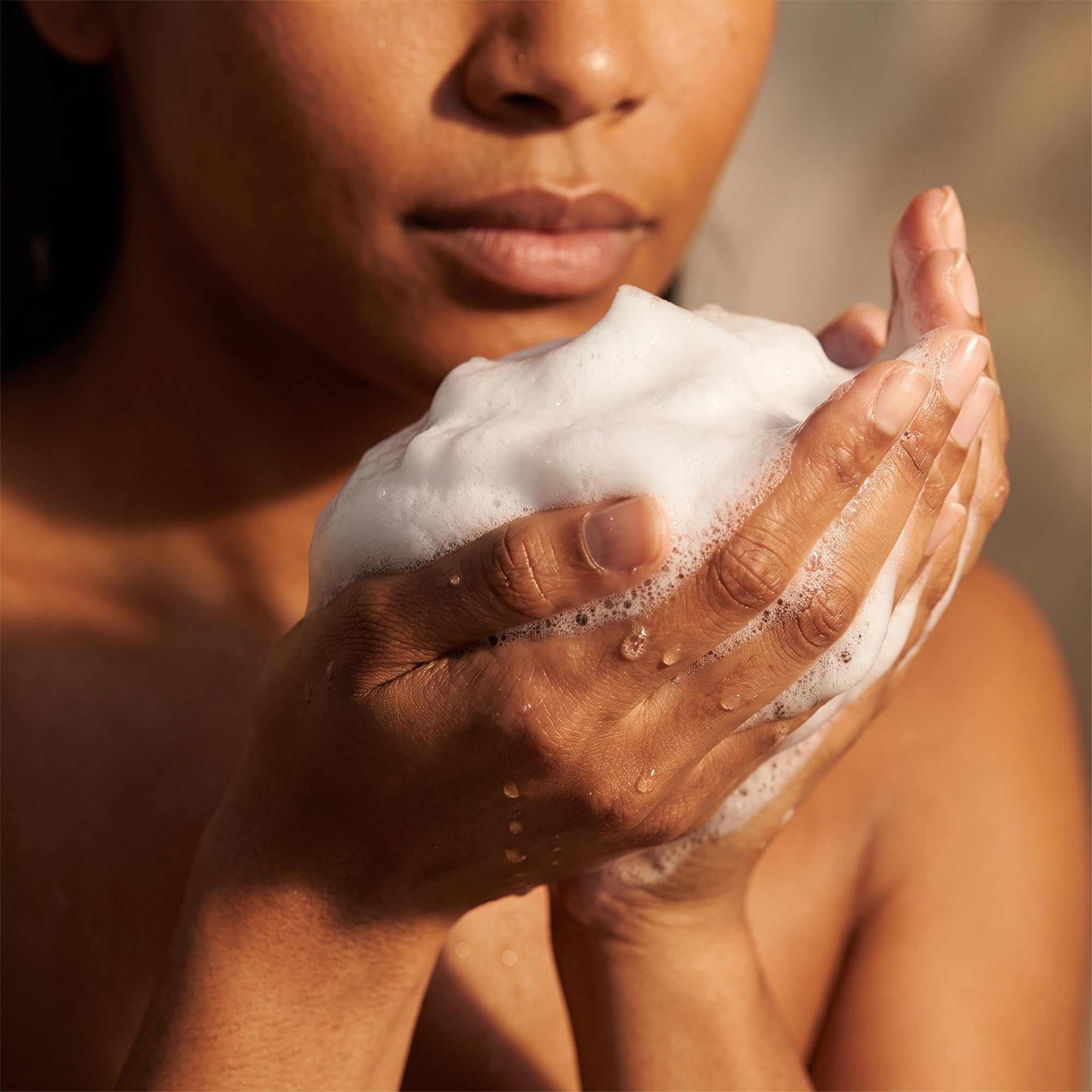 Hydrating Facial Cleanser lather worked into foam in hands ready for a soothing cleanse