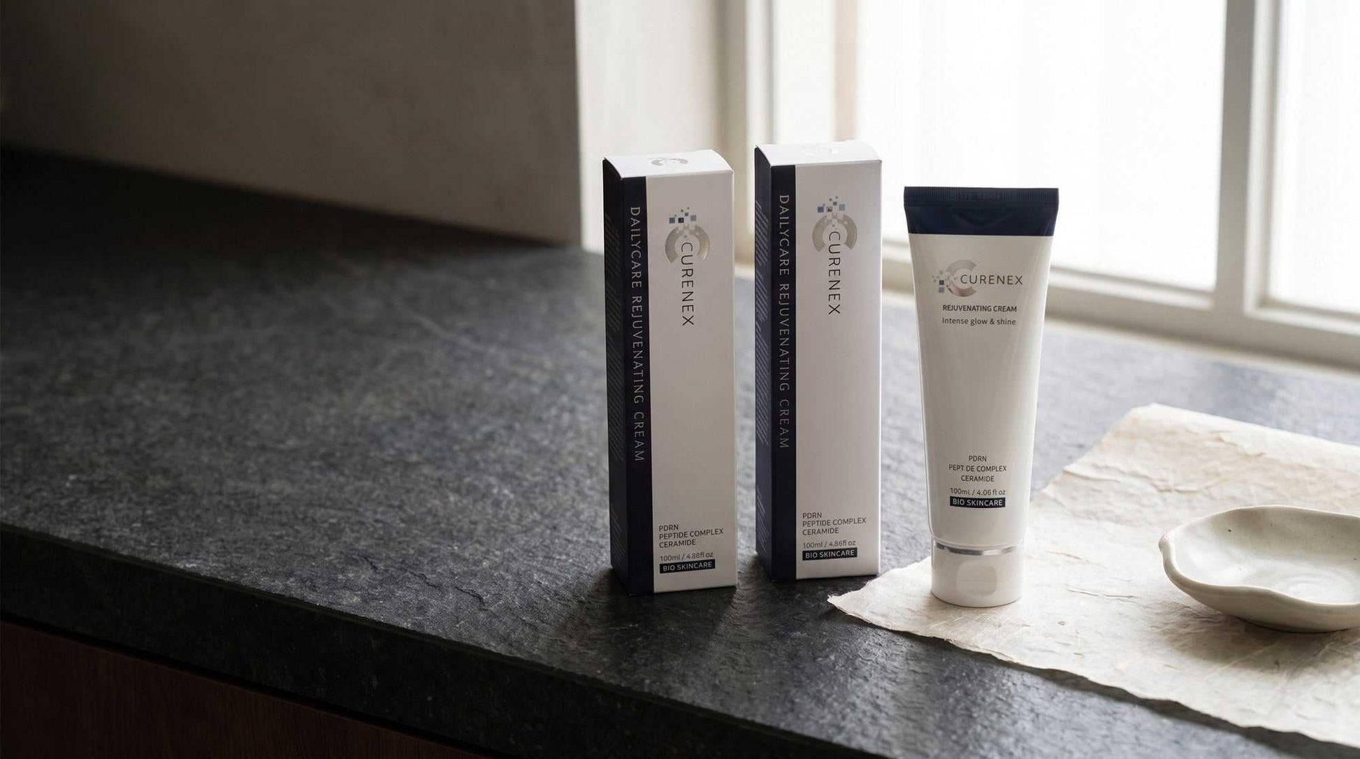 Curenex rejuvenating face cream origin scene styled in soft natural light