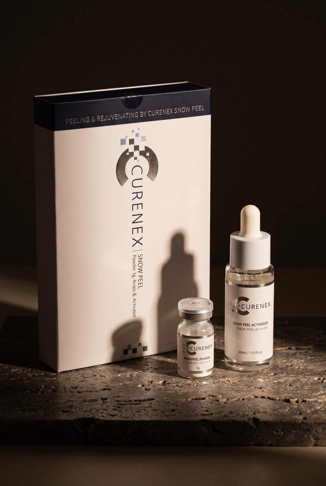 Curenex Snow Peel with Salmon DNA hero shot of the powder and activator duo