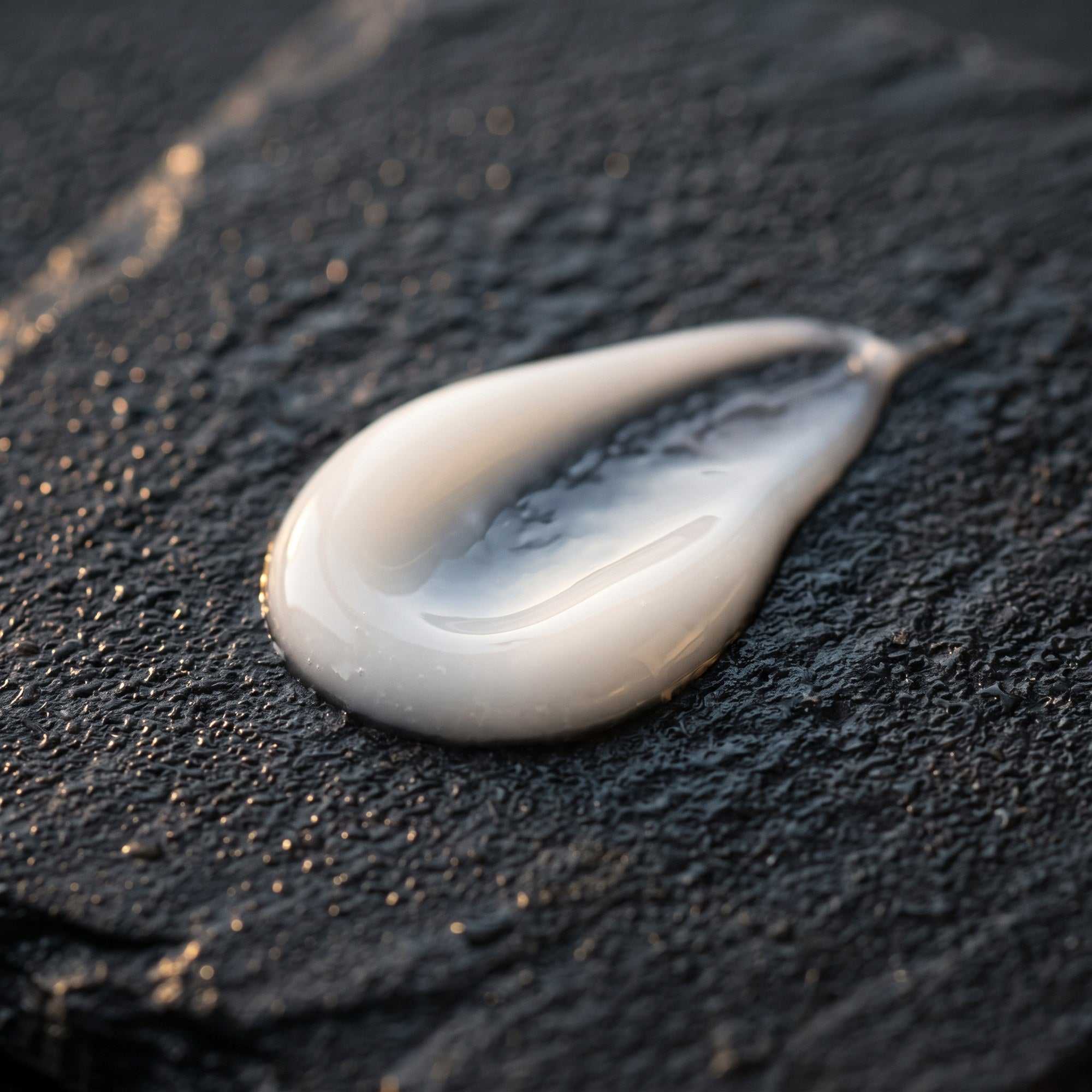 Glow Salmon DNA Curenex sunscreen lotion swirl showing a lightweight dewy finish