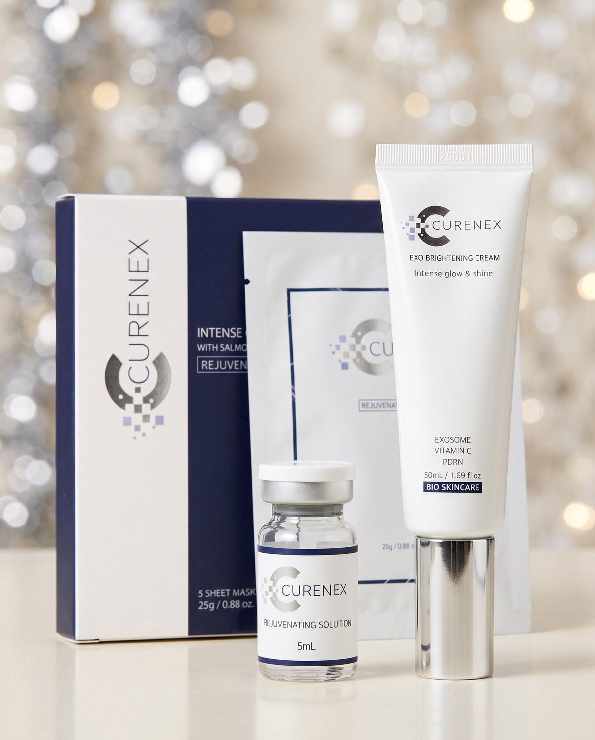 Skincare gift set, The Little Luxury Gift Set with white cream tube, serum vial and sheet masks in navy and white packaging