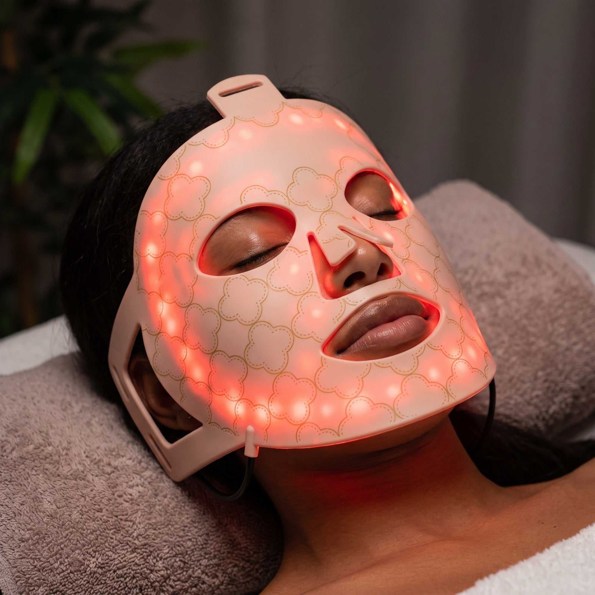 Dual near infrared and red light LED face mask worn on the face for a radiant looking complexion