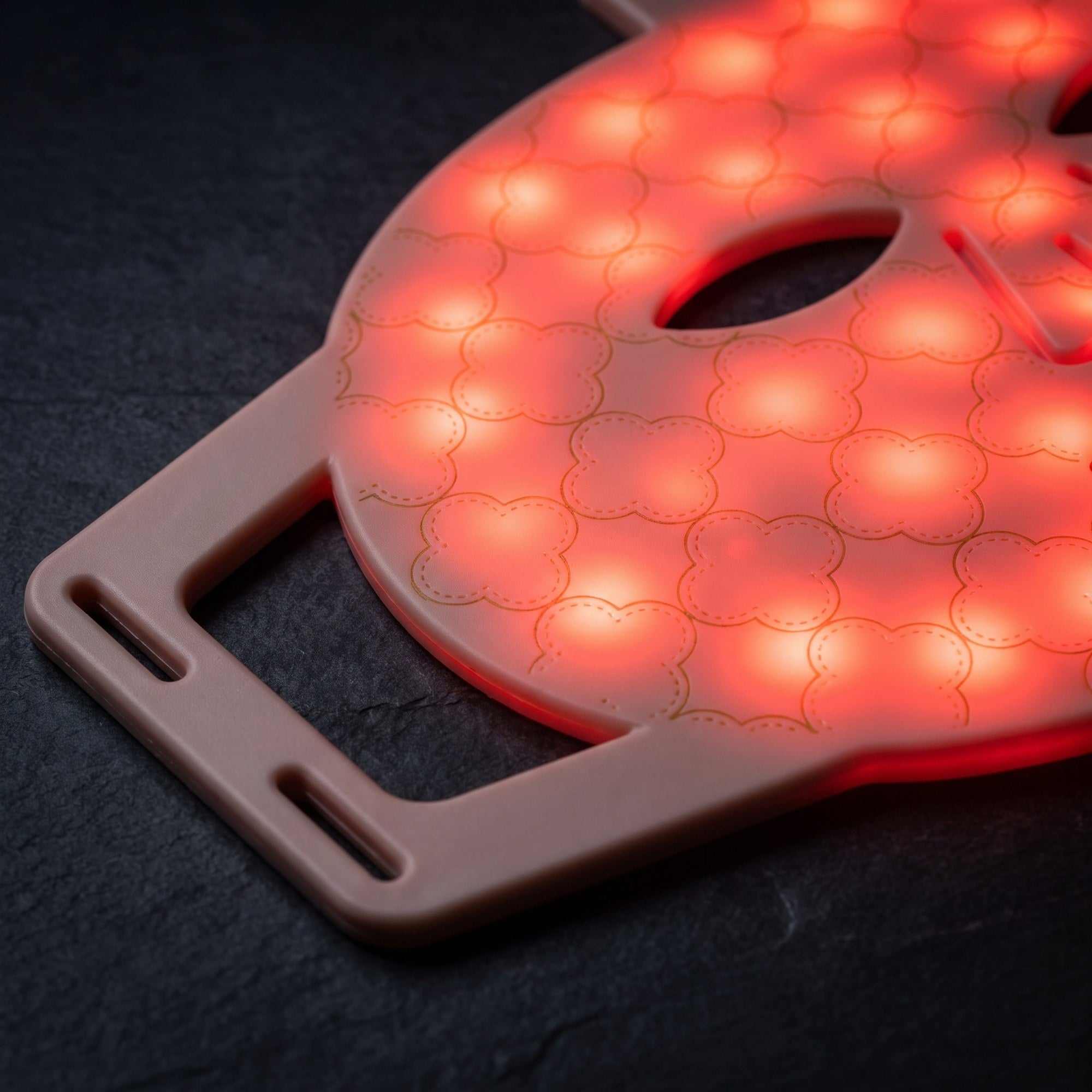 Dual near infrared and red light LED face mask panel close up showing the LED beauty device